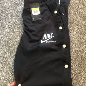 nike pants with buttons all up the sides. BNWT